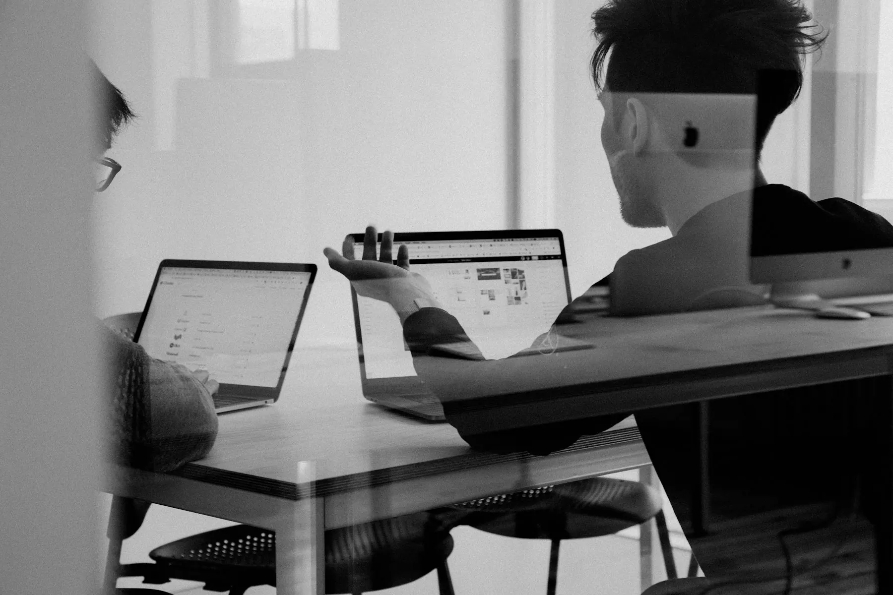 A team reviewing a project plan on a large screen